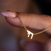 Chai necklace in solid gold with red garnet detail | Hebrew necklace by Sivan Lotan Jewelry
