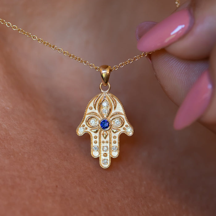 Floral Hamsa Necklace with Blue Sapphire & Diamonds | Symbolic Jewelry