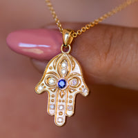 Floral Hamsa Necklace with Blue Sapphire & Diamonds | Symbolic Jewelry