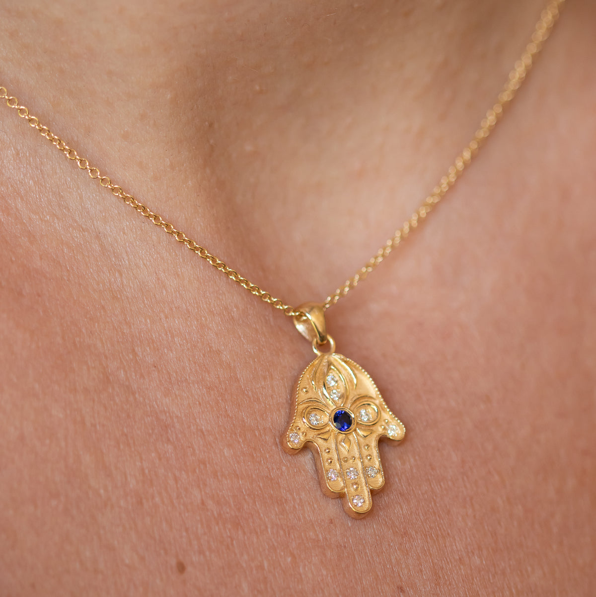 Floral Hamsa Necklace with Blue Sapphire & Diamonds | Symbolic Jewelry