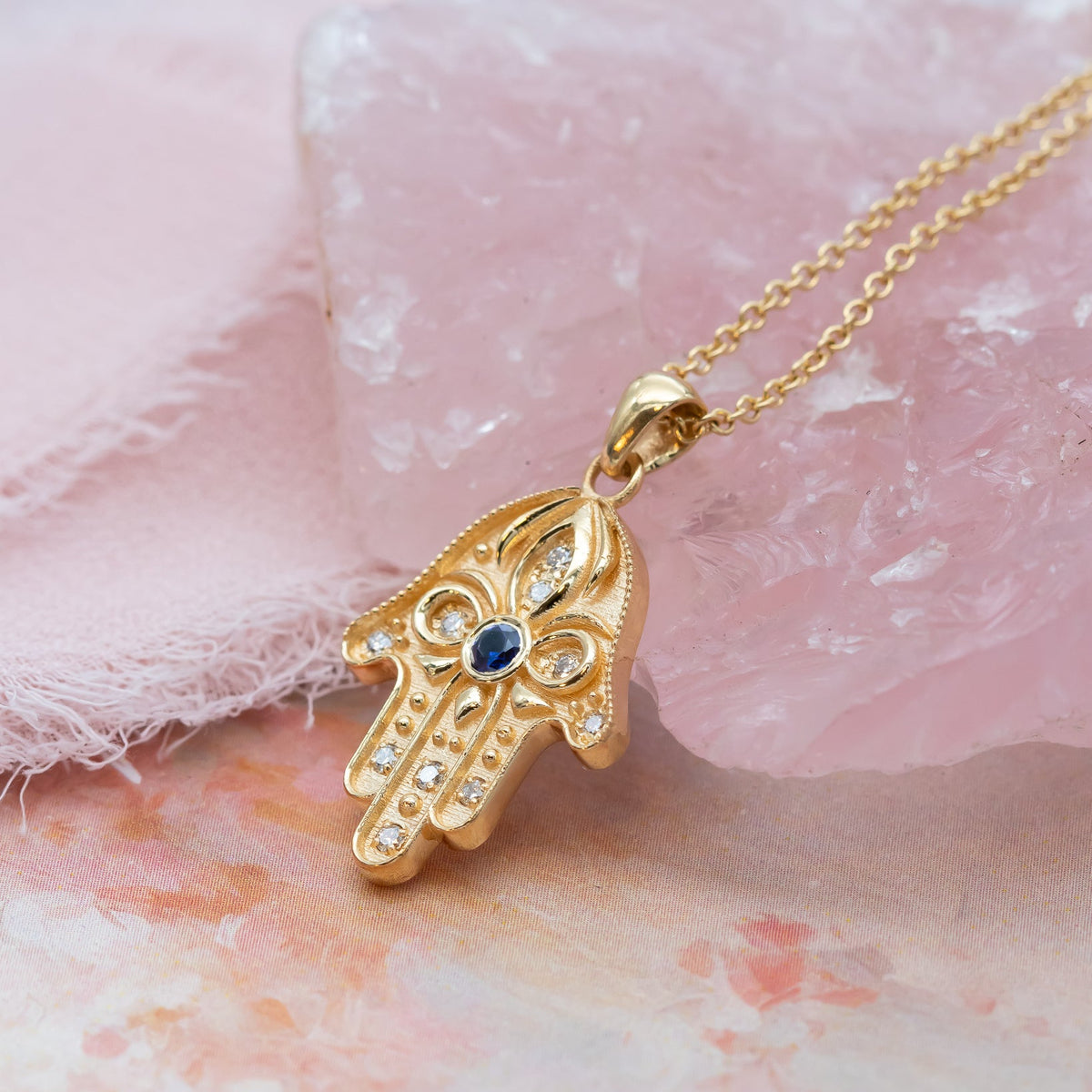Floral Hamsa Necklace with Blue Sapphire & Diamonds | Symbolic Jewelry