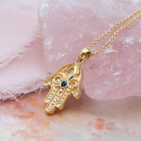Floral Hamsa Necklace with Blue Sapphire & Diamonds | Symbolic Jewelry