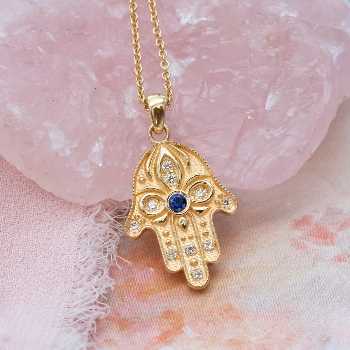Floral Hamsa Necklace with Blue Sapphire & Diamonds | Symbolic Jewelry