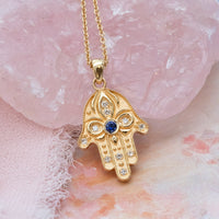 Floral Hamsa Necklace with Blue Sapphire & Diamonds | Symbolic Jewelry
