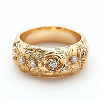 A 14k gold floral ring with diamonds, featuring a detailed design of blossoms with a larger diamond at the center of each flower, set against a white background.