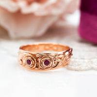 A rose gold floral ring with ruby gemstones, inspired by the spirit of spring and renewal. Perfect for celebrating love, life, and the beauty of new beginnings.