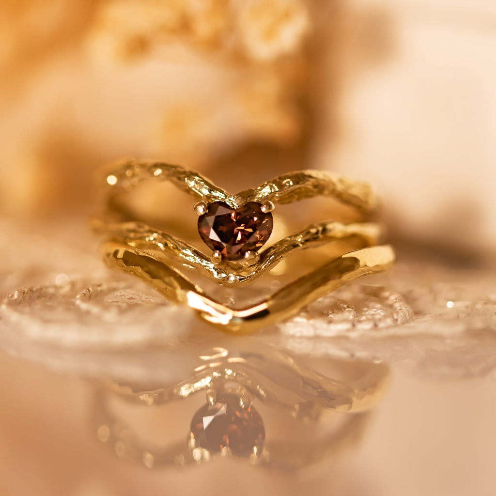 Nature-inspired twig gold ring with a heart-shaped brown diamond and a matching band