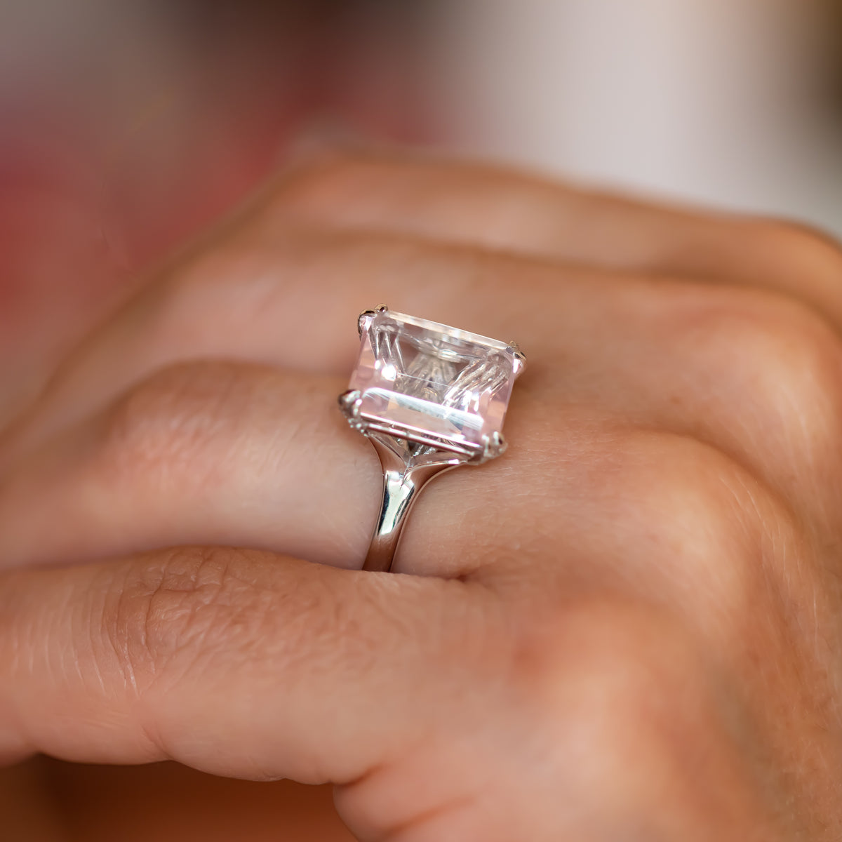 Pink rose quartz ring worn every day, step-cut stone on a fine gold band