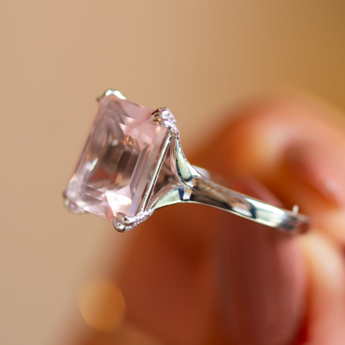 Alternative engagement ring with rose quartz, split-shoulder gold band with diamond accents