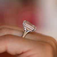 Rose quartz engagement ring with pavé diamond gallery, pale pink step-cut centre stone on a slender gold band