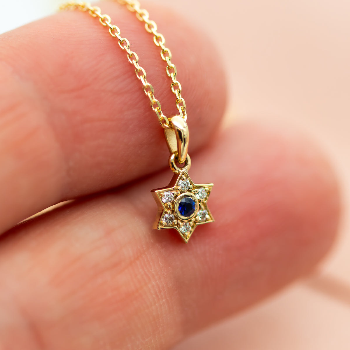 Small Star of David Charm necklace with blue sapphire and diamonds in 14k gold