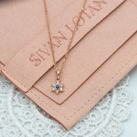 Small Star of David Charm necklace with blue sapphire and diamonds in 14k rose gold