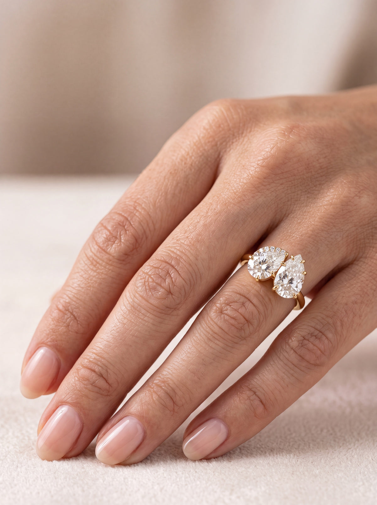 Sonder diamond engagement ring worn on hand Close-up