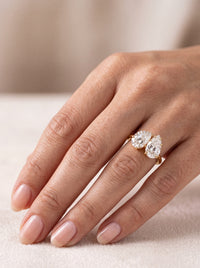Sonder diamond engagement ring worn on hand Close-up