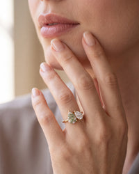 elara-green-damond and sapphire engagement-ring-on-hand