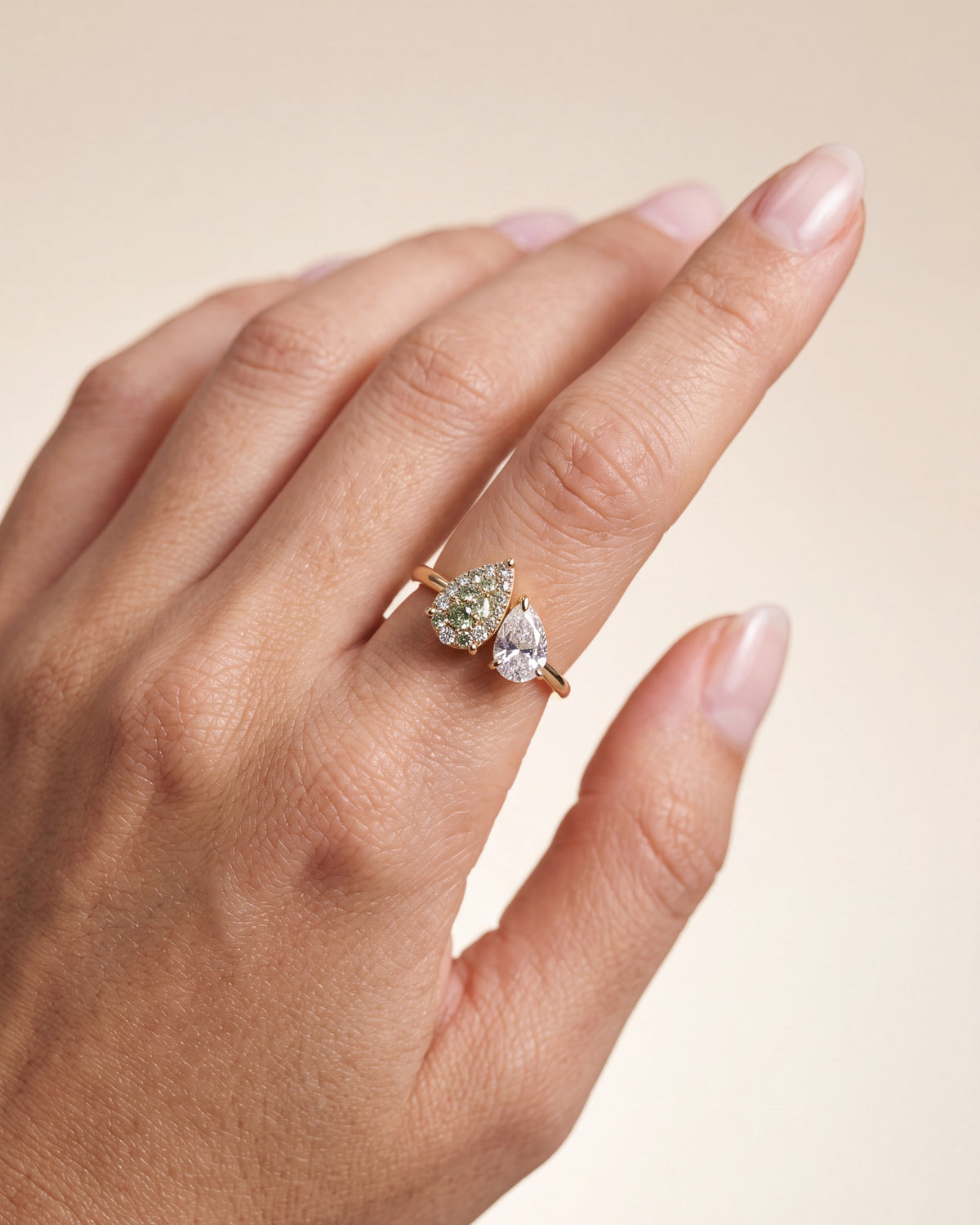 elara-green-engagement-ring-on-hand