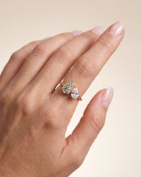 elara-green-engagement-ring-on-hand