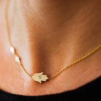 Sideways Hamsa Necklace with Diamonds and Sapphire