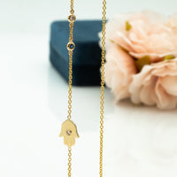Sideways Hamsa Necklace with Diamonds and Sapphire