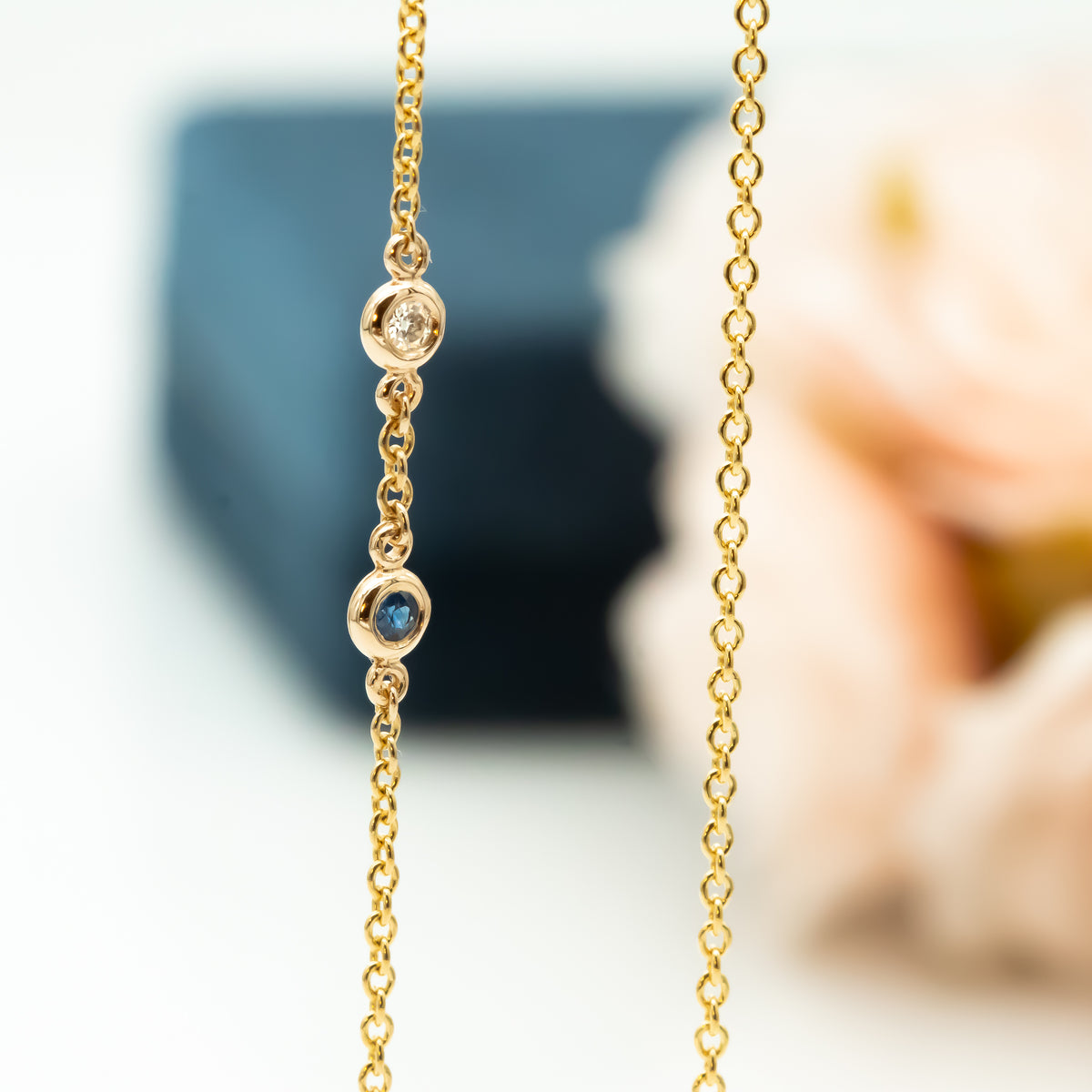 Sideways Hamsa Necklace with Diamonds and Sapphire