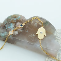 Sideways Hamsa Necklace with Diamonds and Sapphire