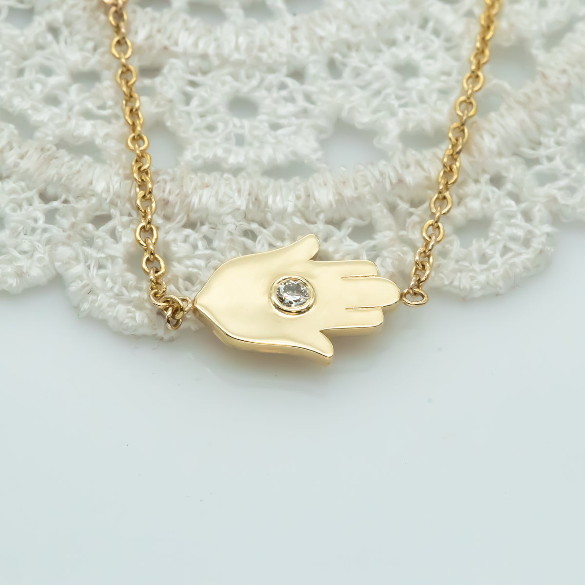 Sideways Hamsa Necklace with Diamonds and Sapphire
