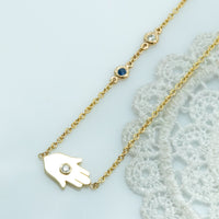 Sideways Hamsa Necklace with Diamonds and Sapphire