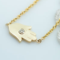 Sideways Hamsa Necklace with Diamonds and Sapphire