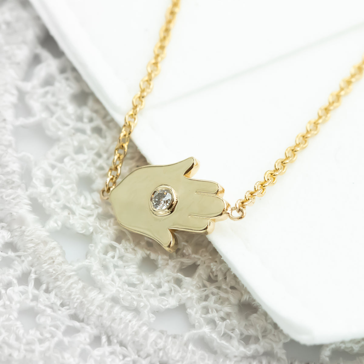 Sideways Hamsa Necklace with Diamonds and Sapphire