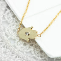 Sideways Hamsa Necklace with Diamonds and Sapphire