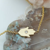 Sideways Hamsa Necklace with Diamonds and Sapphire
