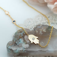 Sideways Hamsa Necklace with Diamonds and Sapphire