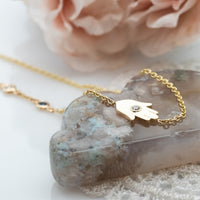 Sideways Hamsa Necklace with Diamonds and Sapphire