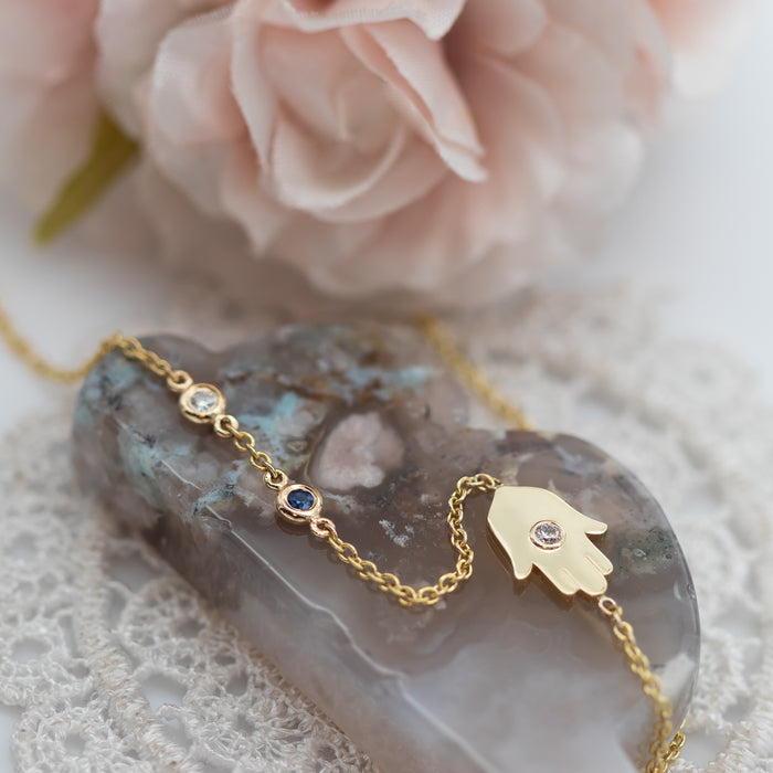 Sideways Hamsa Necklace with Diamonds and Sapphire