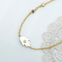 Sideways Hamsa Necklace with Diamonds and Sapphire