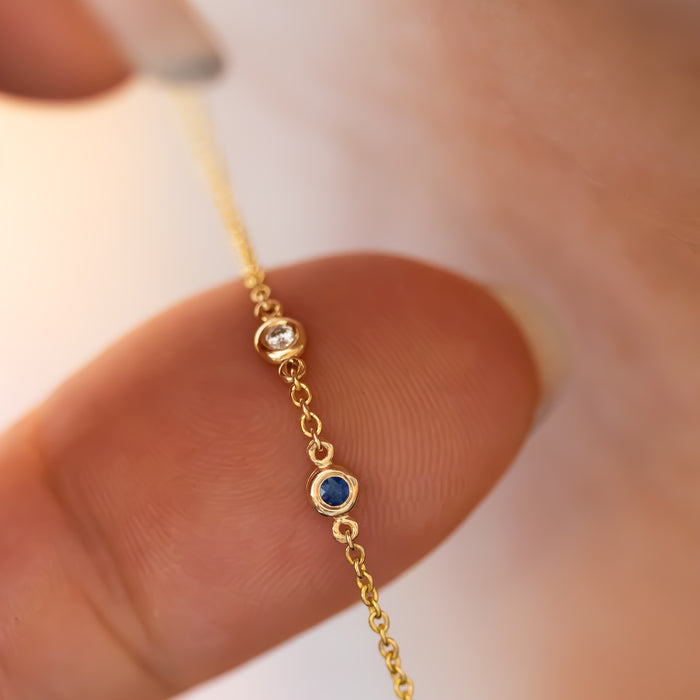 Sideways Hamsa Necklace with Diamonds and Sapphire