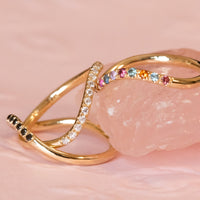 rainbow sapphire ring, black diamond ring, and white diamond ring