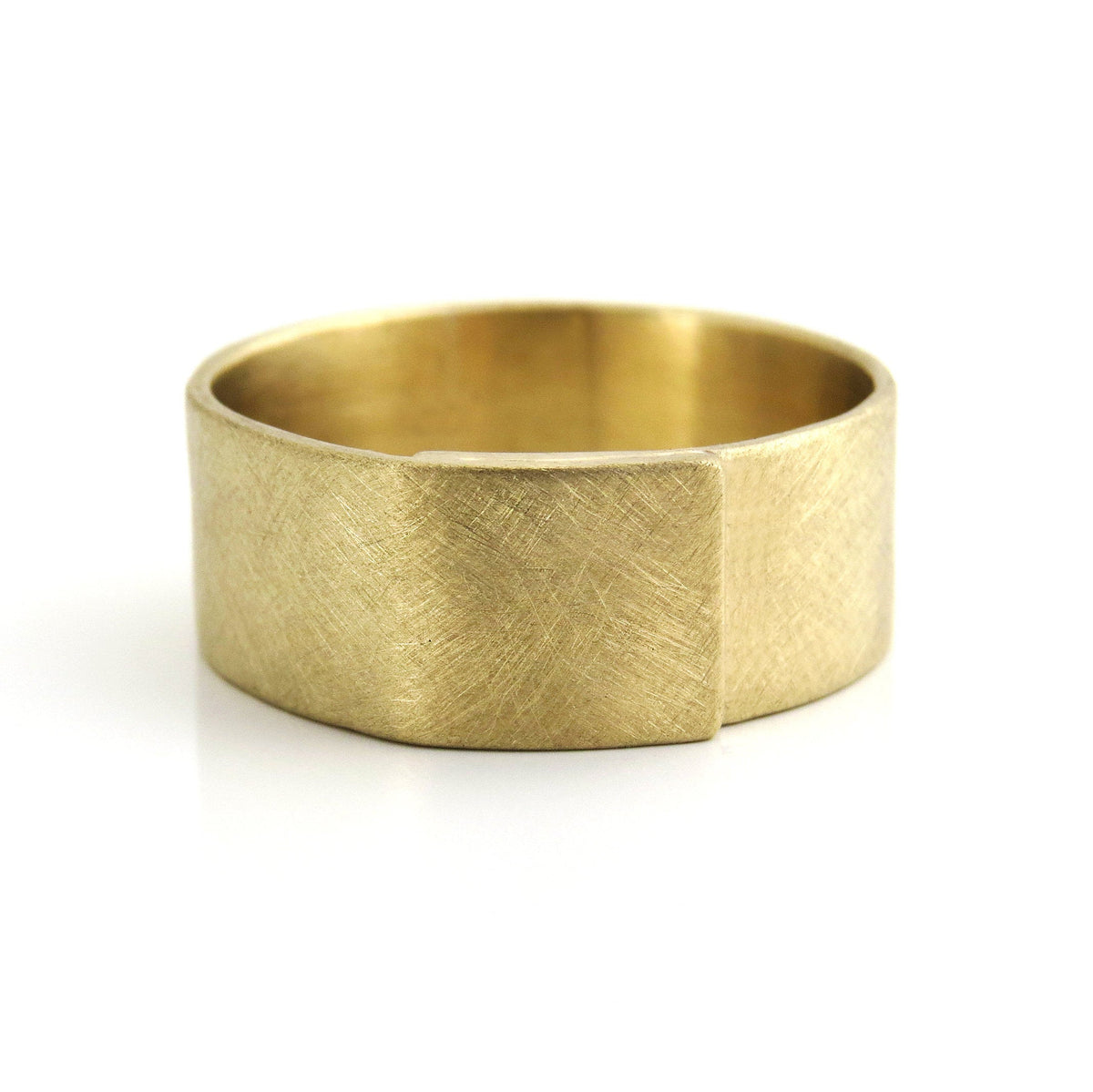 Gold Cigar wedding band in brushed matte finish