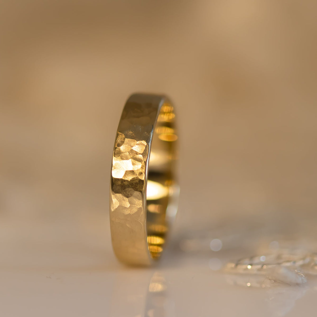 Hammered gold wedding band for men in 14k gold