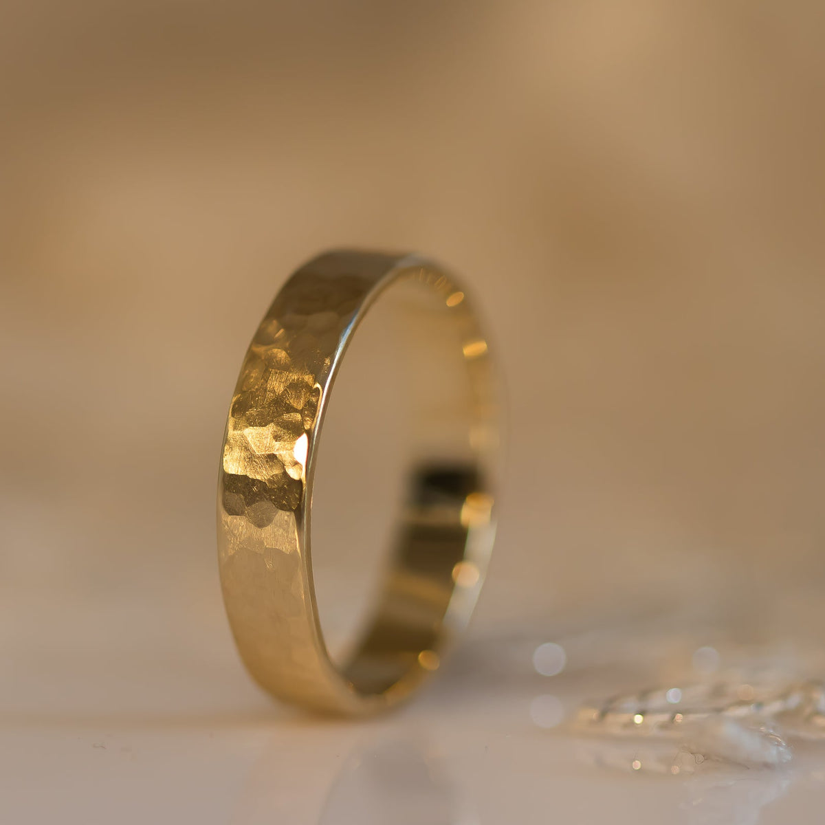 Hammered gold wedding band for men in 14k gold
