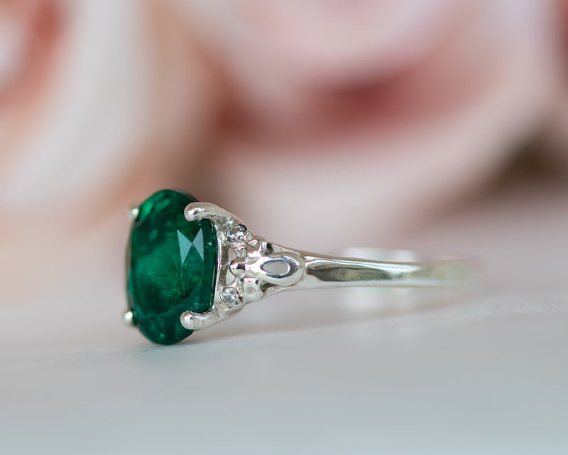Pure elegance! A vibrant green emerald cut emerald center stone with  triangle… | Gold jewelry simple necklace, Emerald engagement ring, Three  stone engagement rings